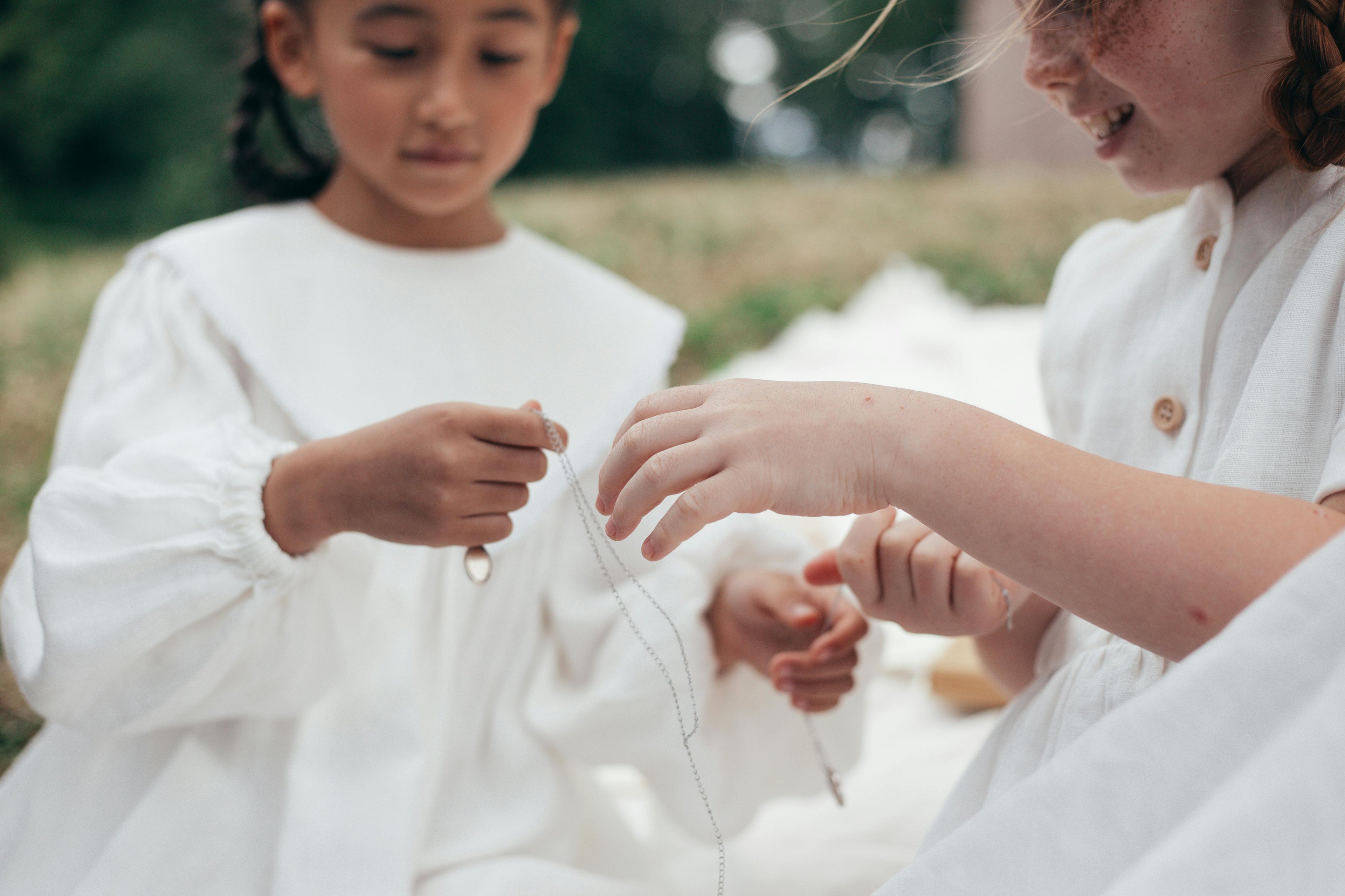 Children holding jewellery